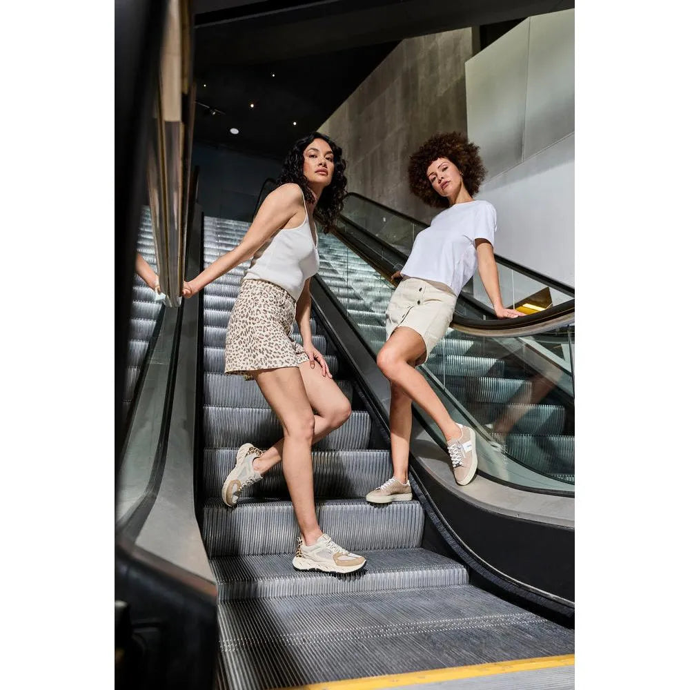 Rieker L5903-20 ladies camel suede zip and lace shoes worn by two women standing on an escalator.