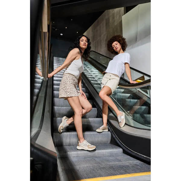 Rieker L5903-20 ladies camel suede zip and lace shoes worn by two women standing on an escalator.