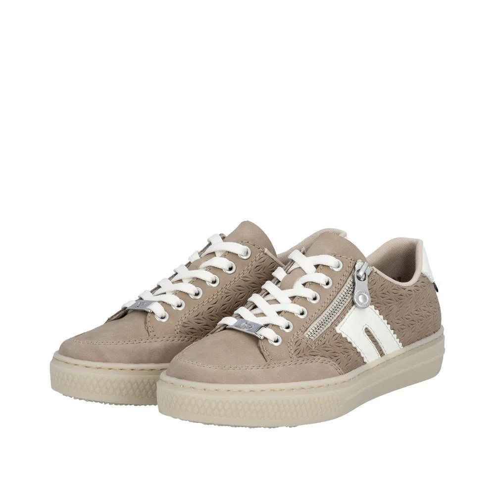 Women's beige suede sneakers with lace-up and zipper detail, textured side panels, and chunky rubber soles.