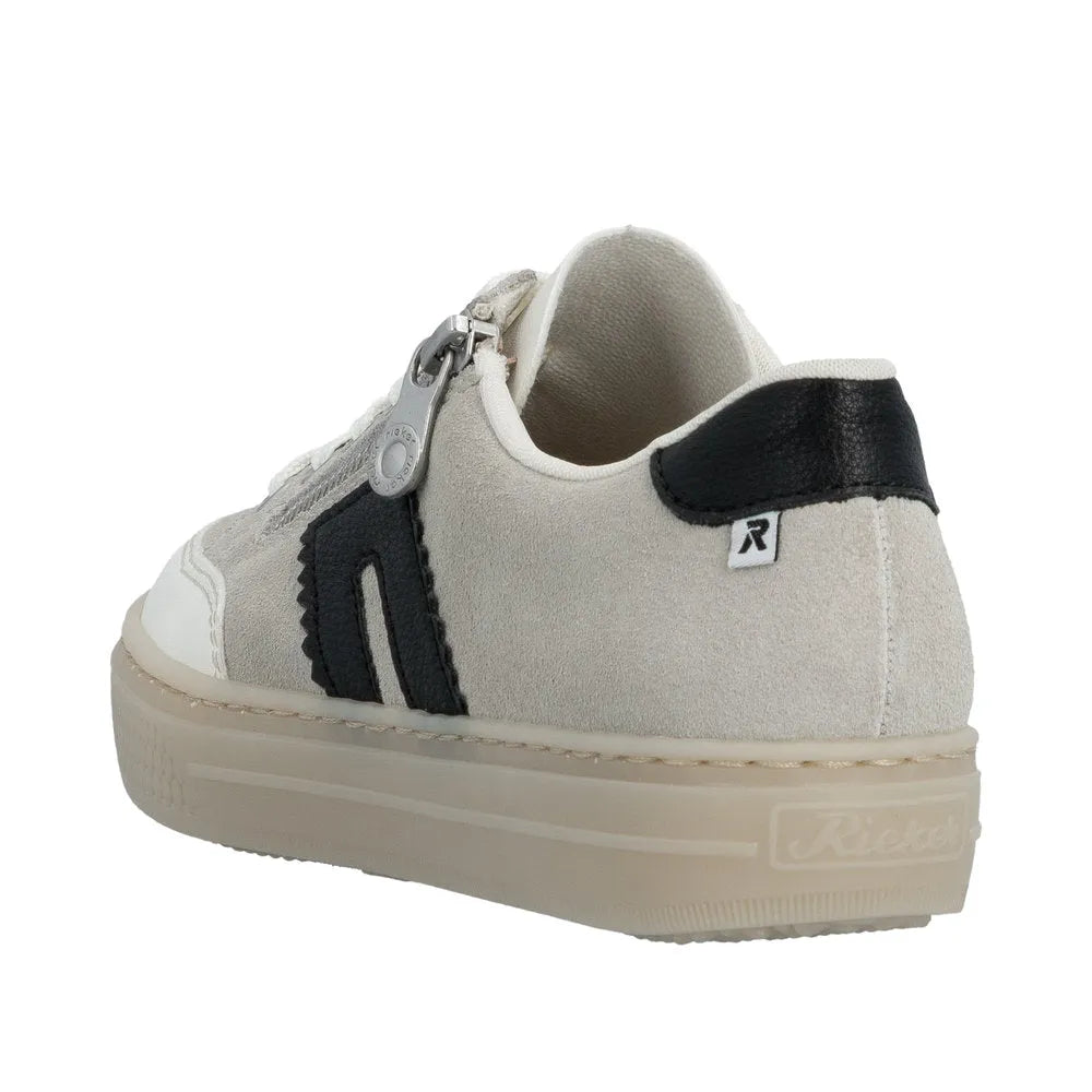 Rieker L5903-40 women's off-white suede shoes with lace-up and zipper, black accents, and a thick rubber sole.