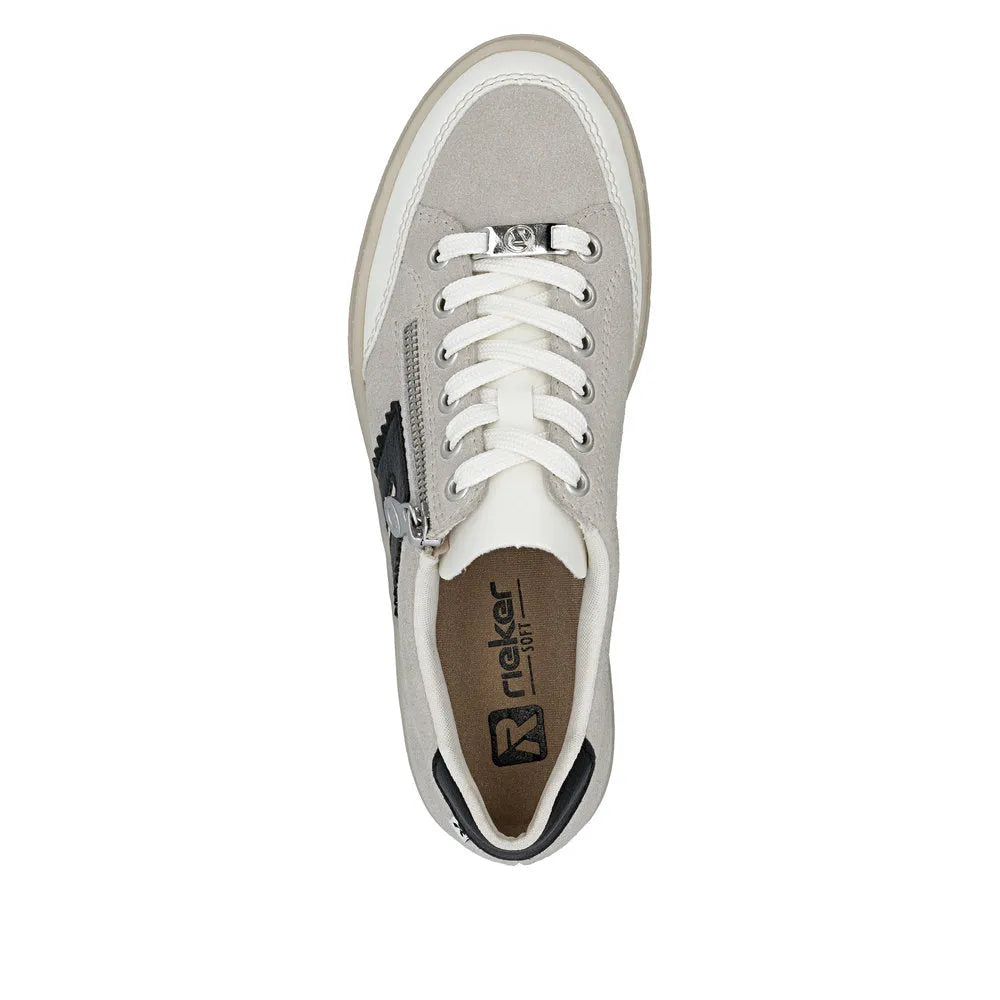 Rieker L5903-40 off-white suede women's sneakers with lace-up and zip closure, cushioned interior, and sporty style.