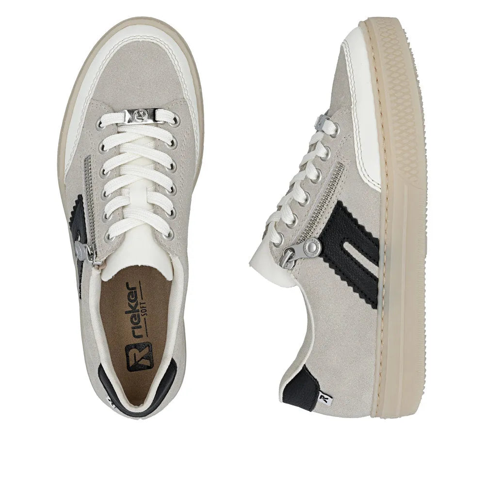 Rieker L5903-40 women's off-white suede shoes with zippers, lace-up, chunky sole, and black detailing.