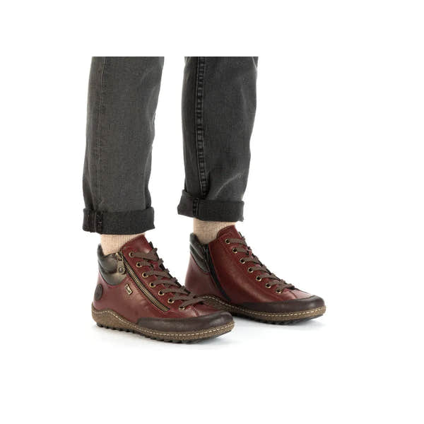Rieker L7500-35 women's red water-resistant ankle boots with side zipper and lace-up design.
