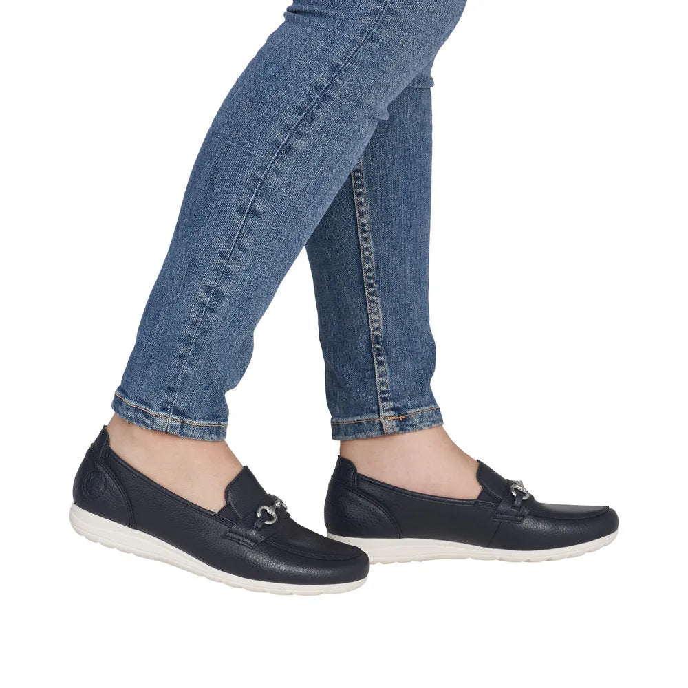 Rieker L9355-14 ladies navy leather slip-on shoes with a white rubber sole, featuring a sleek, casual style.
