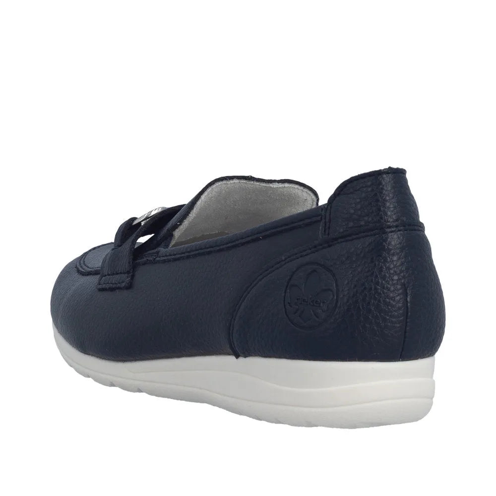 Navy leather slip-on shoe with a white cushioned sole and embossed logo on the heel.