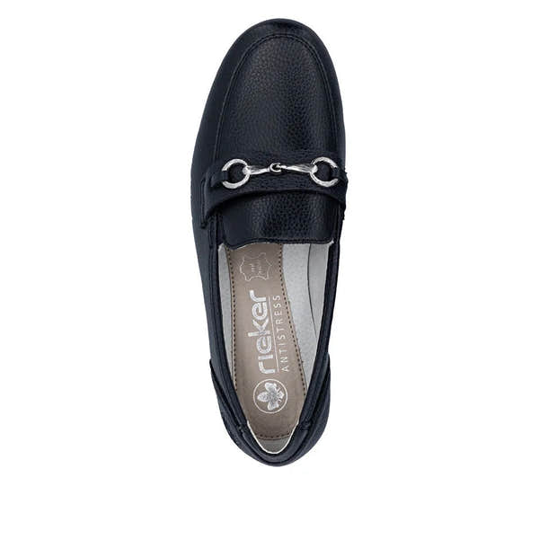 Black leather slip-on shoe with metal horsebit detail, cushioned beige interior with Rieker branding and anti-stress features.