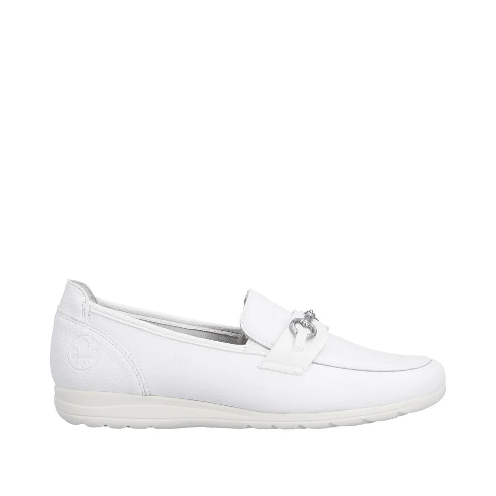 White leather slip-on shoes for women with a decorative strap and silver-tone bow detail, featuring a flexible sole.