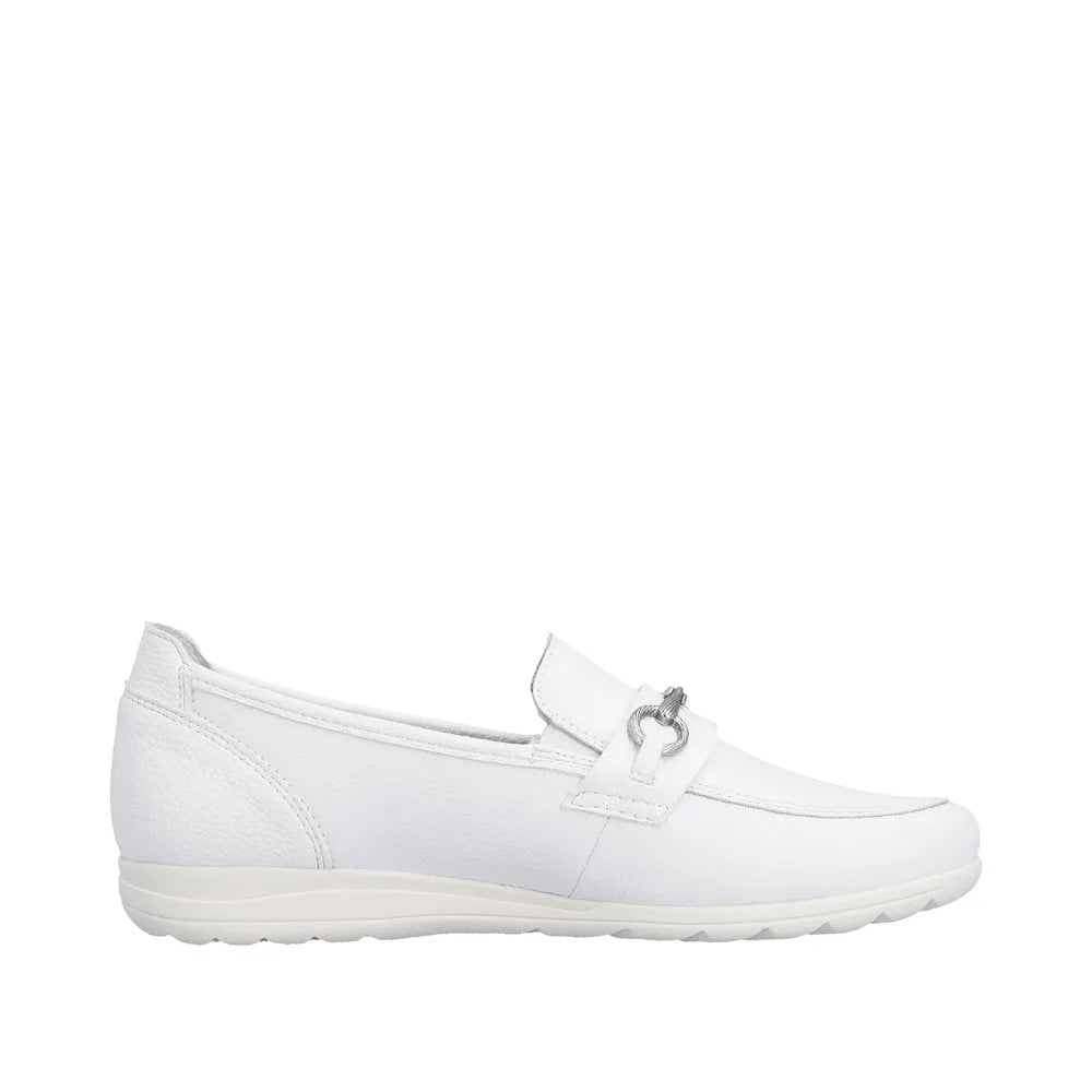White leather slip-on shoes for women with a decorative metal buckle detail.