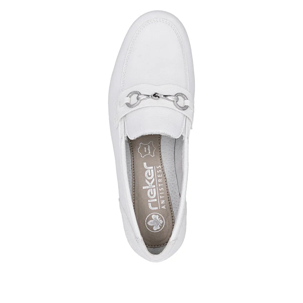 White leather slip-on shoe with metal chain detail across the vamp, cushioned insole, and rounded toe style.