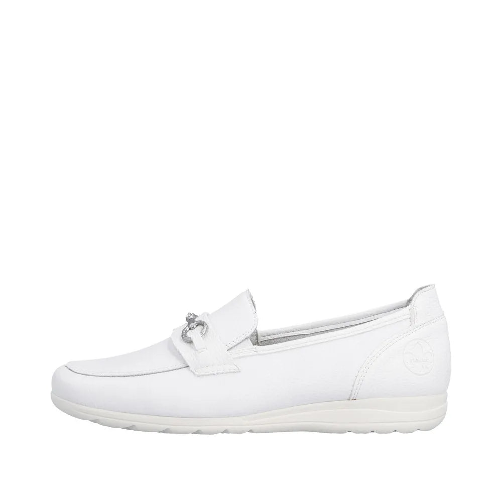 White leather slip-on shoe with a strap detail and small metal ornament, low heel, and textured finish.