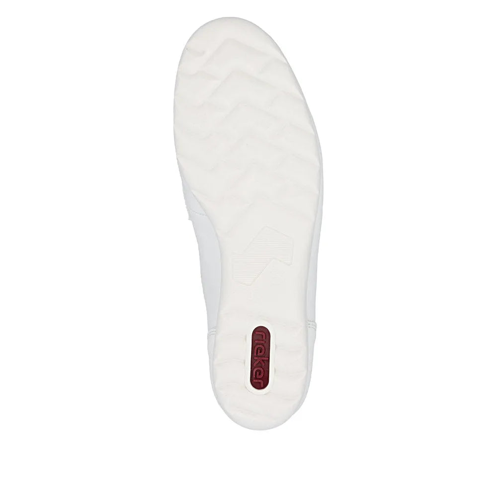 White leather slip-on shoes with cushioned sole, rubber outsole, and Rieker branding on heel tab.