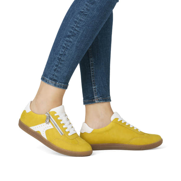 Rieker L9700-68 ladies yellow trainers with zip and lace-up design, casual sporty look, and brown rubber sole.