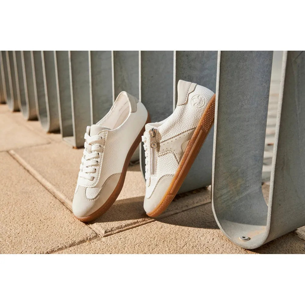 Rieker L9700-80 women's white lace and zip sneakers with gum soles, casual stylish footwear on outdoor pavement.
