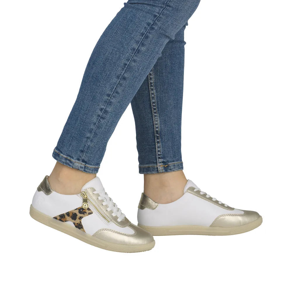 Rieker L9700-81 women's white, gold, and leopard print zip and lace sneakers with sporty design and stylish details.