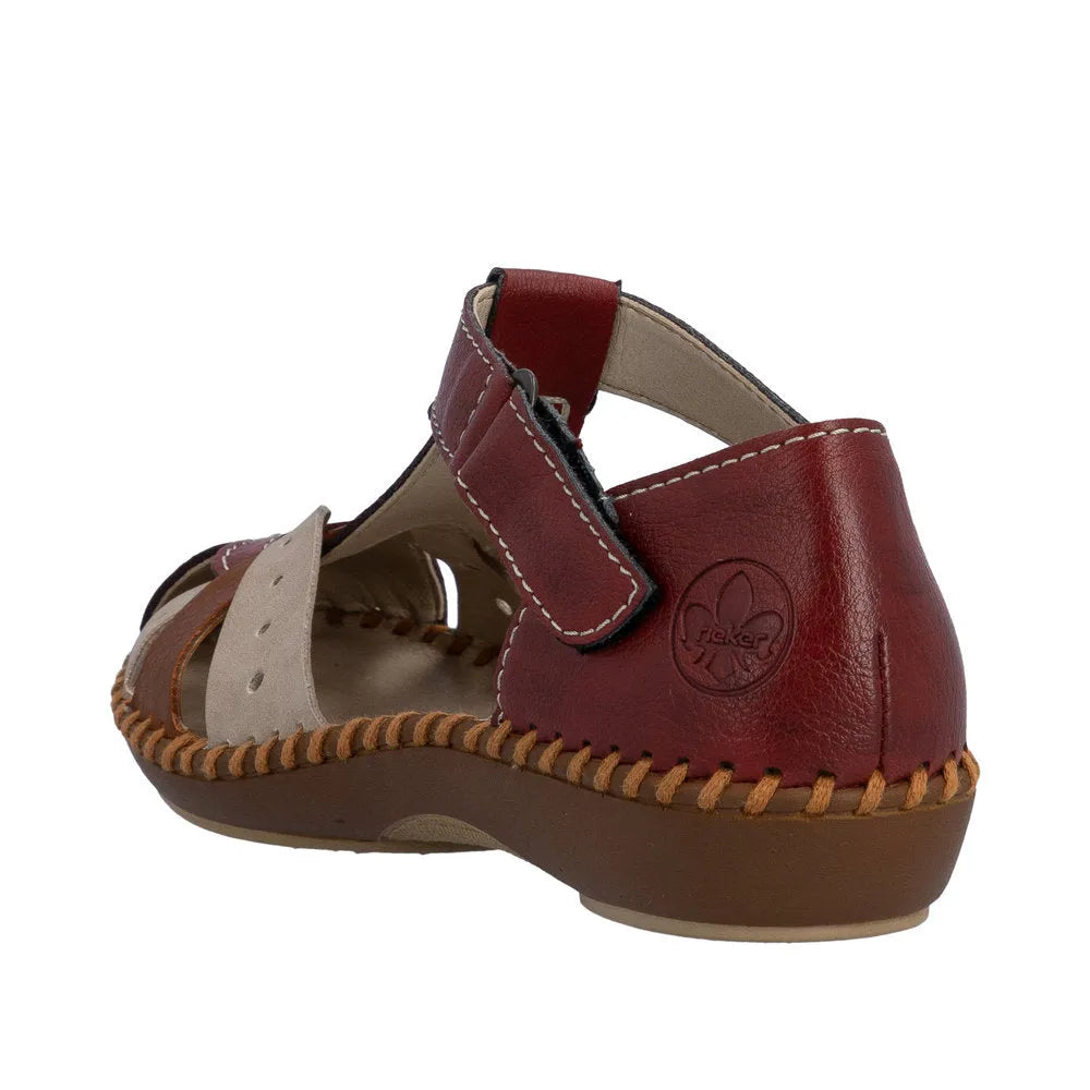 Red leather sandals with touch fastening, open design, and contrasting beige details. Comfortable and stylish for summer wear.