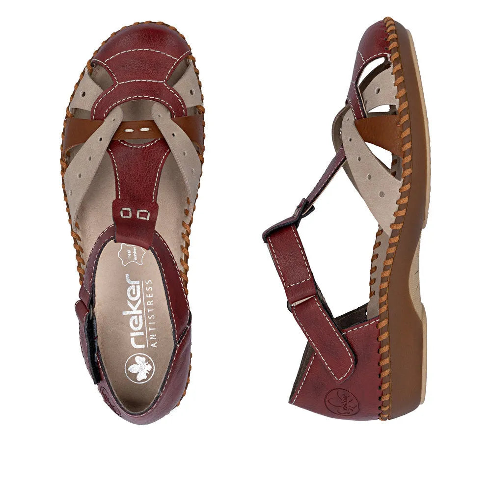 Red leather ladies' sandals with touch fastening, featuring a comfortable design and contrasting tan accents.