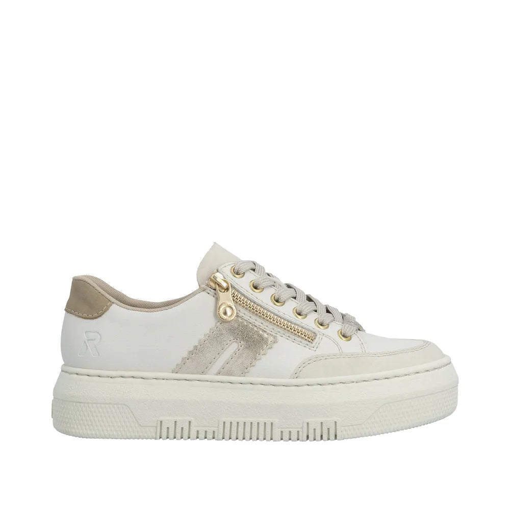 Off-white leather trainer with gold zip, lace-up closure, beige accents, and chunky sole.
