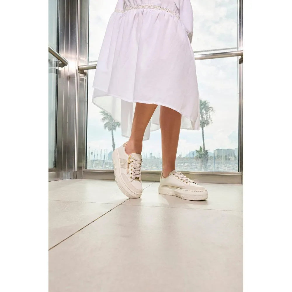 Ladies off-white leather trainers with zip and lace-up detail, casual style, low top, and chunky sole.