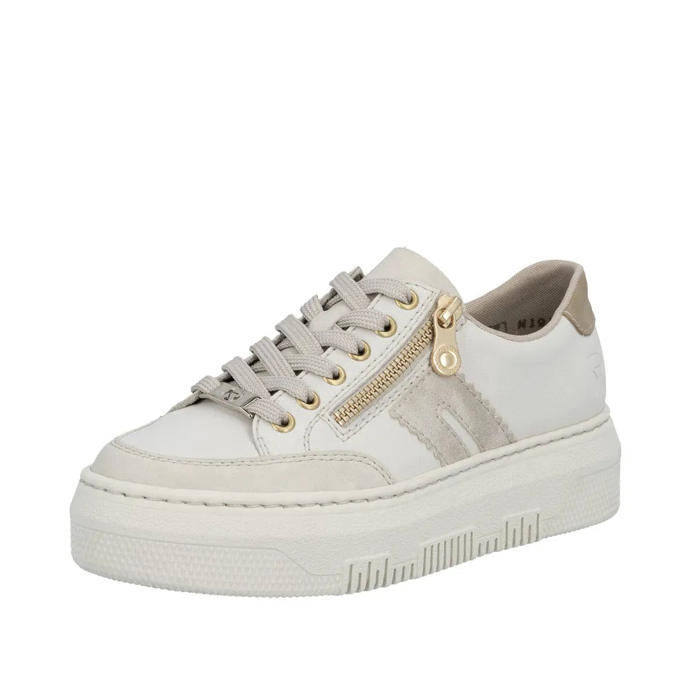 Off-white leather women's trainer with gold zipper detail, lace-up design, thick rubber sole, and contrasting beige accents.