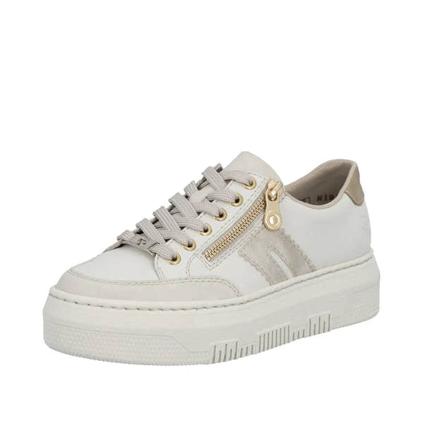 Off-white leather women's trainer with gold zipper detail, lace-up design, thick rubber sole, and contrasting beige accents.