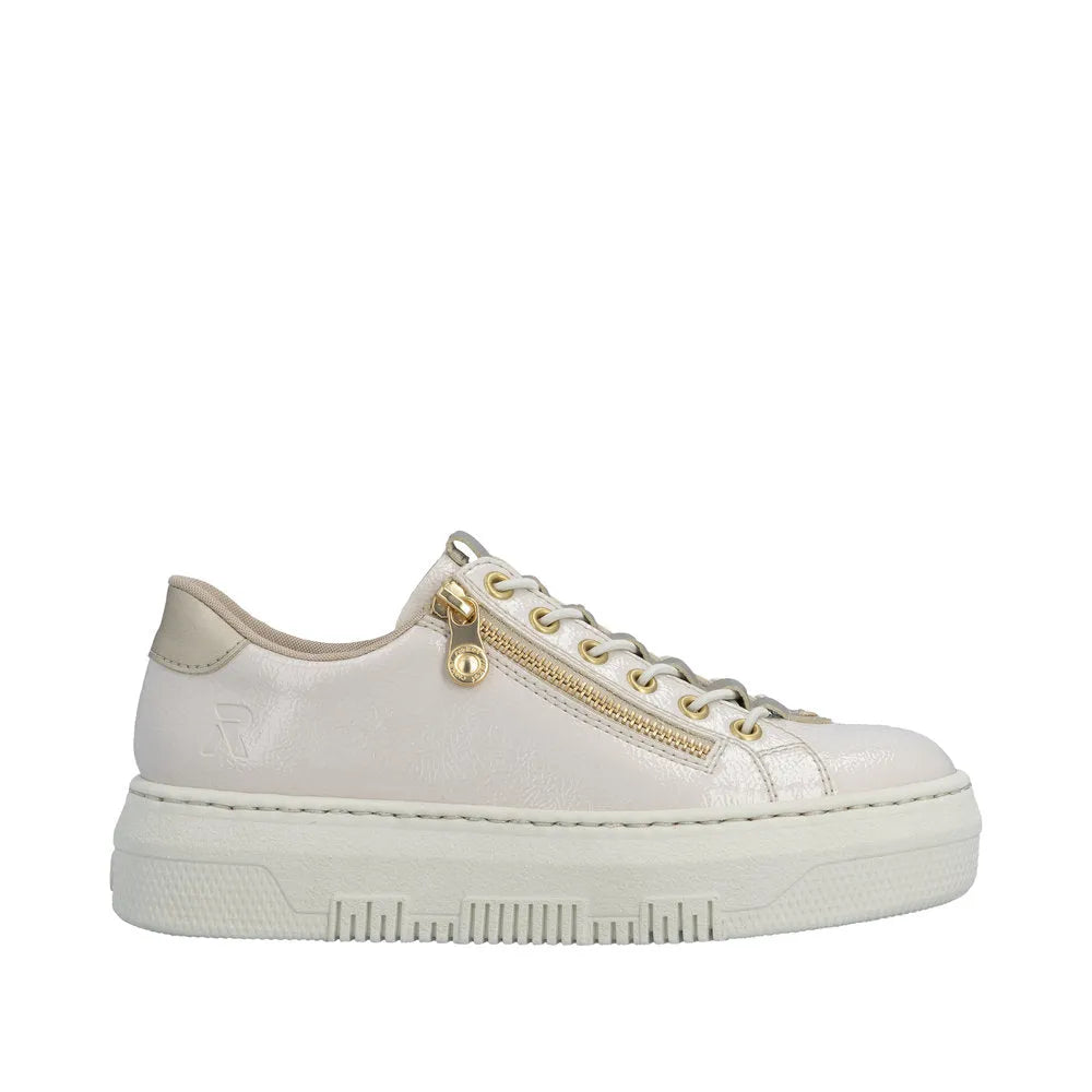 Rieker M1953-80 ladies off-white patent trainers with side zip, gold accents, lace-up front, and thick platform sole.