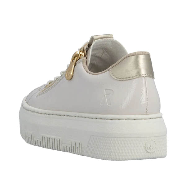 Rieker M1953-80 Ladies off-white patent trainers with side zip and gold accents, chunky sole, and metallic heel detail.