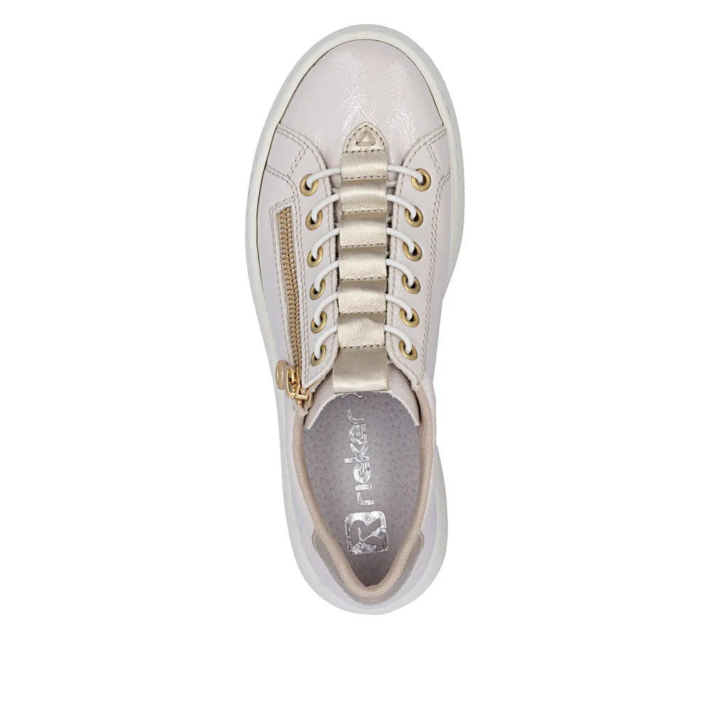 Women's off-white patent trainers with side zipper, lace-up front, gold eyelets, and padded interior.