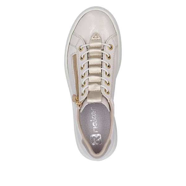 Women's off-white patent trainers with side zipper, lace-up front, gold eyelets, and padded interior.