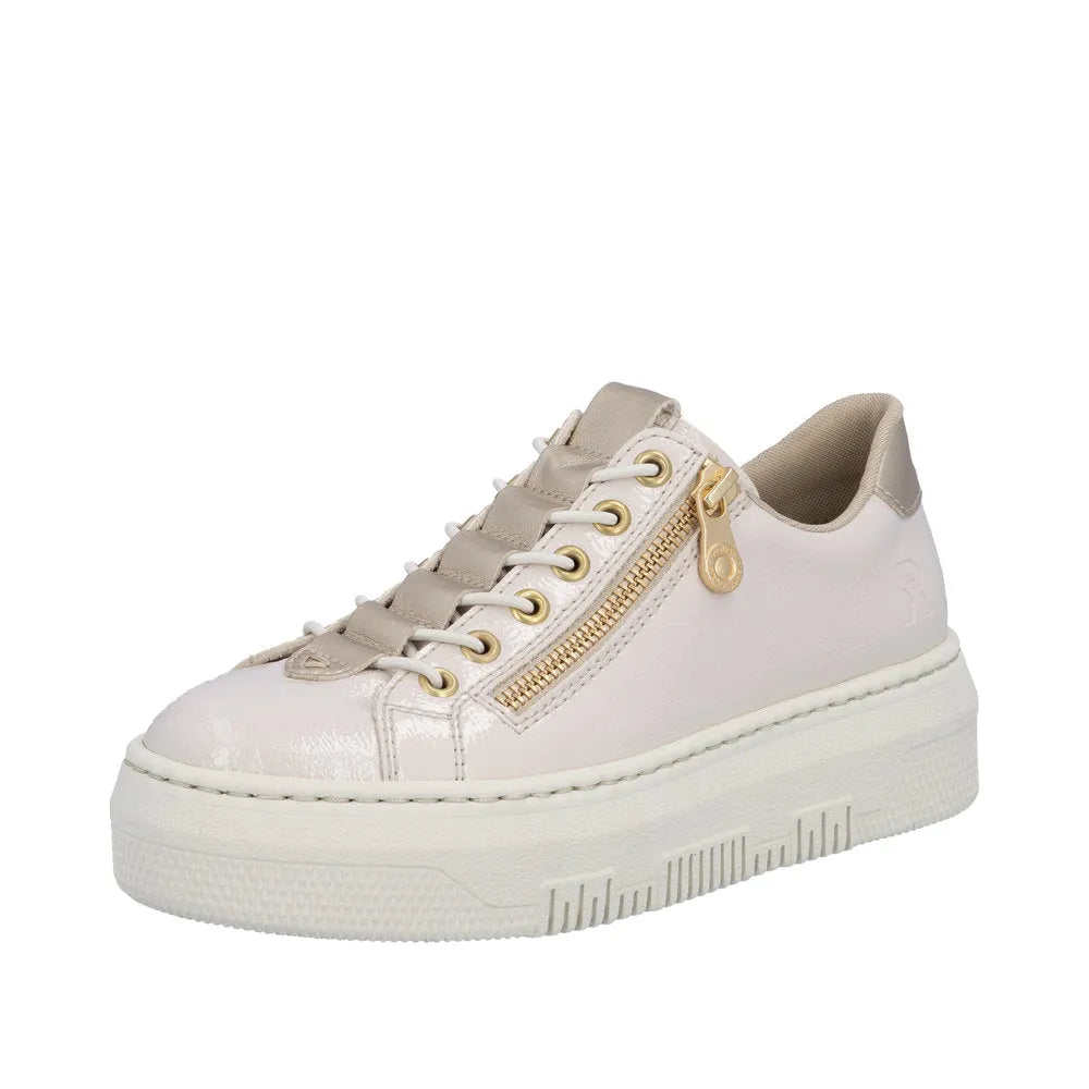 Rieker M1953-80 off-white patent trainer with side zip, gold zipper detail, beige accents, chunky sole, and lace-up design.