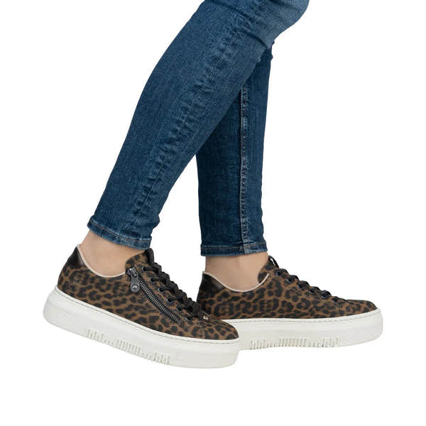 Rieker M1953-90 women's animal print lace-up sneakers with zip detail, black and brown leopard pattern, and white sole.