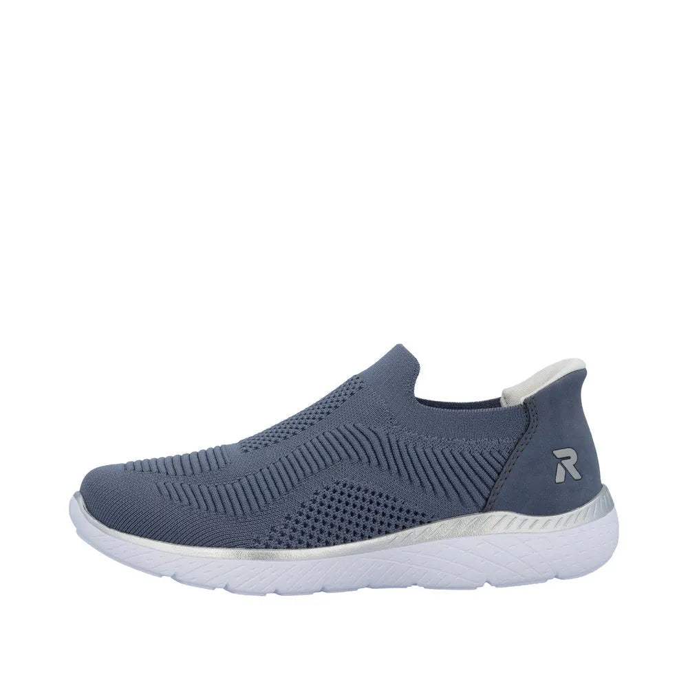 Rieker M5072-10 Ladies Wide Fit Slip-On Trainers in Textured Blue Fabric with White Sole.