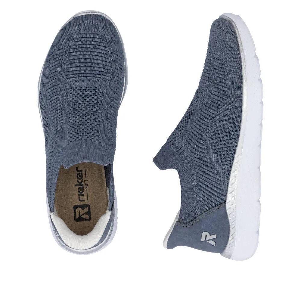 Rieker M5072-10 ladieswide-fit slip-on trainers in textile with breathable knit upper and white rubber sole.