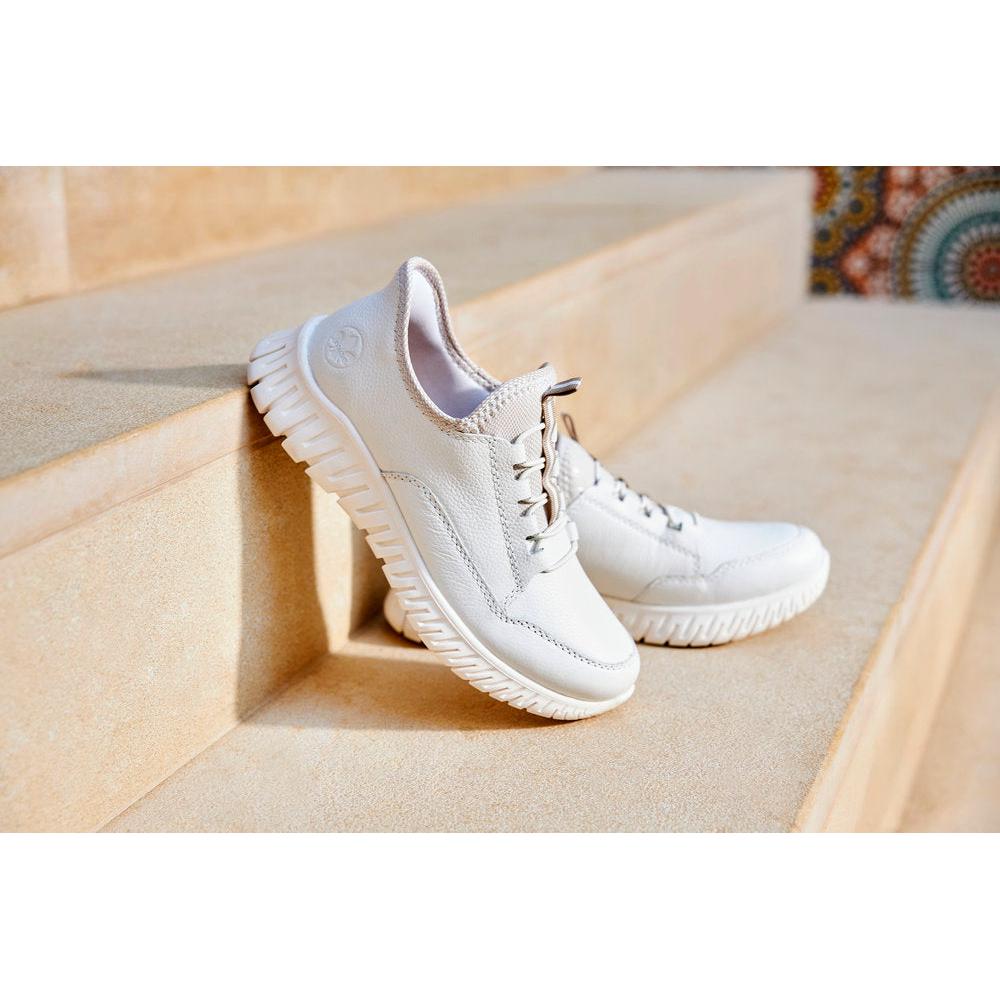 Rieker M5357-80 women's wide-fit beige and white leather trainers with elasticated sides and chunky sole, comfortable casual footwear.