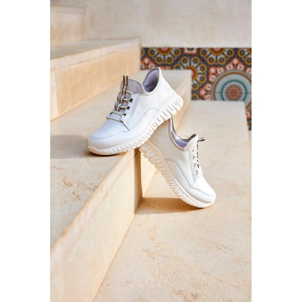 Rieker M5357-80 Ladies Wide Fit Beige and White Leather Elasticated Trainers on beige steps.