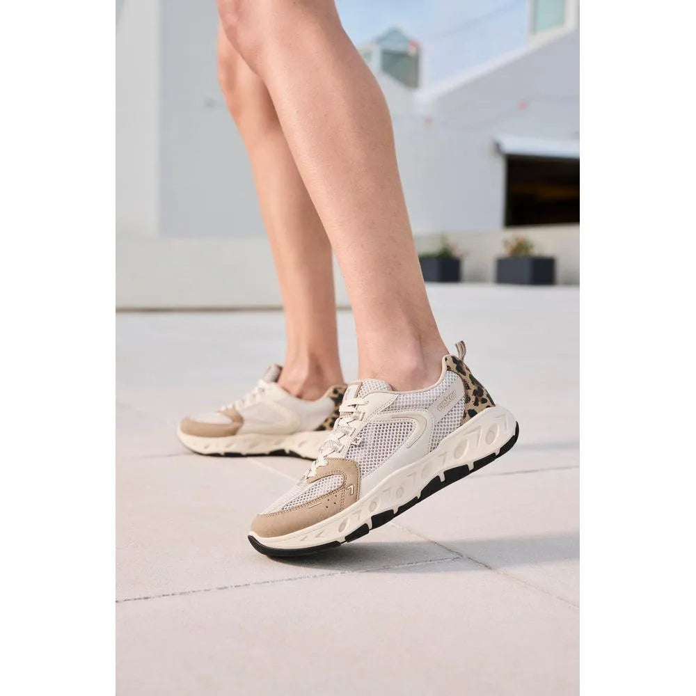 Rieker M6501-60 ladies wide fit beige and brown textile lace-up trainers with leopard print accent on heel.
