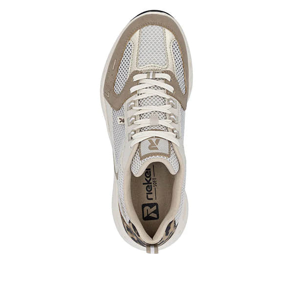 Rieker M6501-60 ladies wide fit beige and brown textile lace-up trainers with mesh panels and cushioned interior.