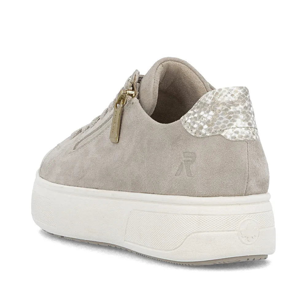 Rieker M7701-60 beige off-white suede sneaker with zip and lace, textured heel detail, and chunky white sole.