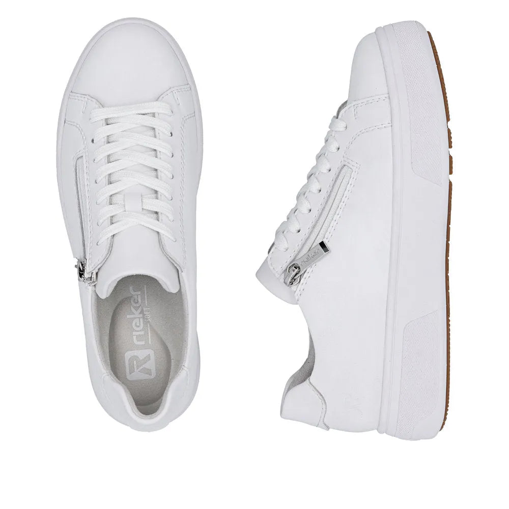 White leather ladies' sneakers with zip and lace details, flat soles, and a brown outsole.