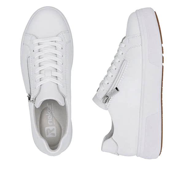 White leather ladies' sneakers with zip and lace details, flat soles, and a brown outsole.
