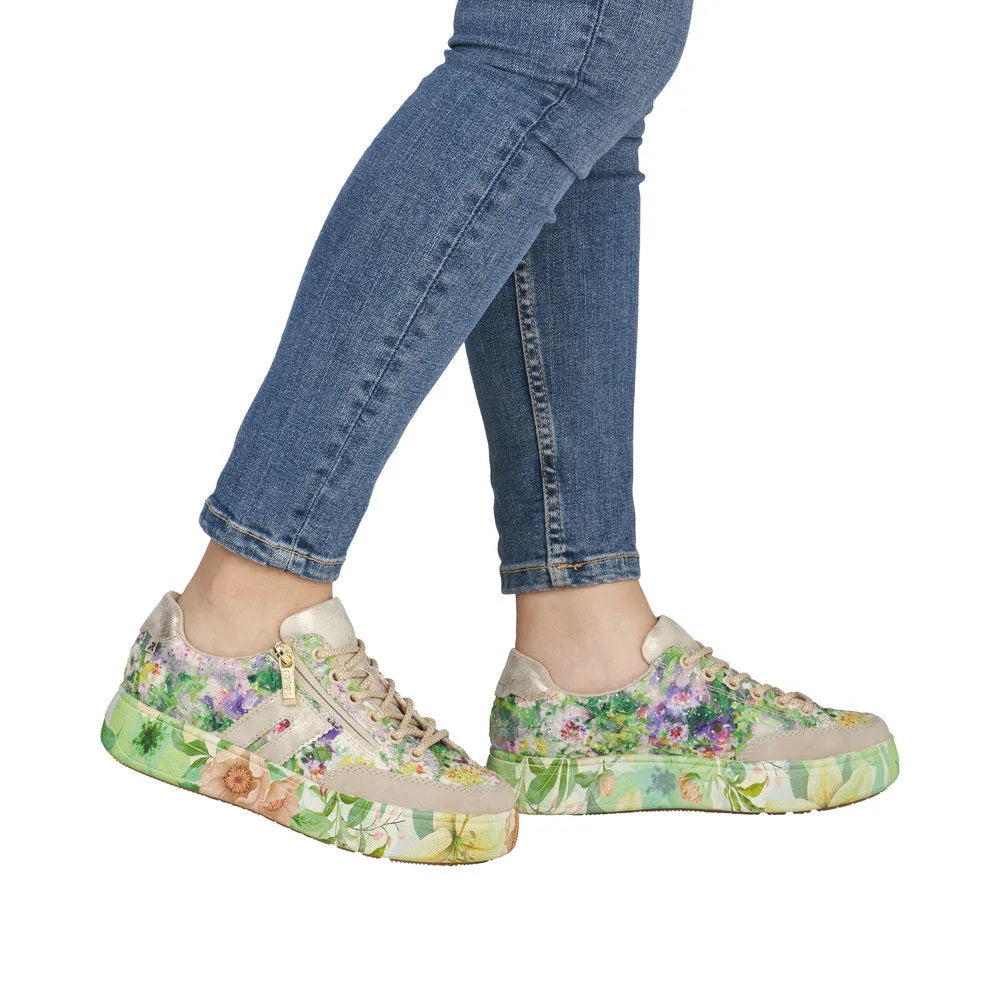 Women's multi-color floral print trainers with side zipper, lace-up detail, and platform sole, made from mixed materials.