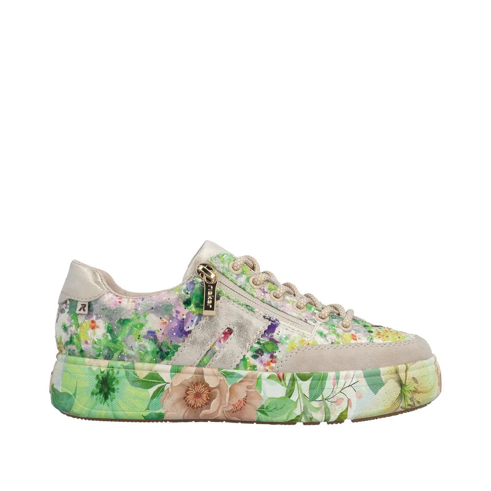 Rieker M7711-91 ladies multi-color canvas trainer with a floral print sole, side zip, laced front, and mixed materials.