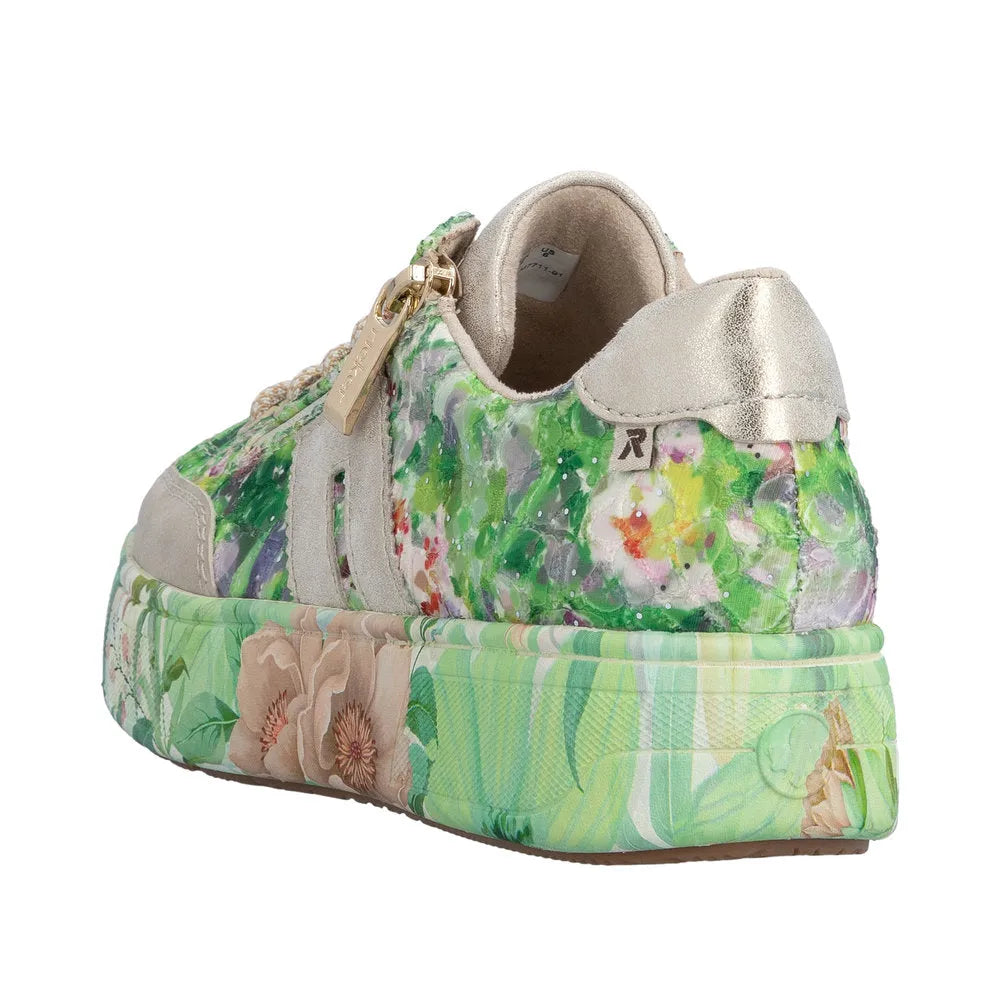 Rieker M7711-91 ladies multi-color floral print trainers with side zipper, beige suede accents, and metallic gold heel detail.
