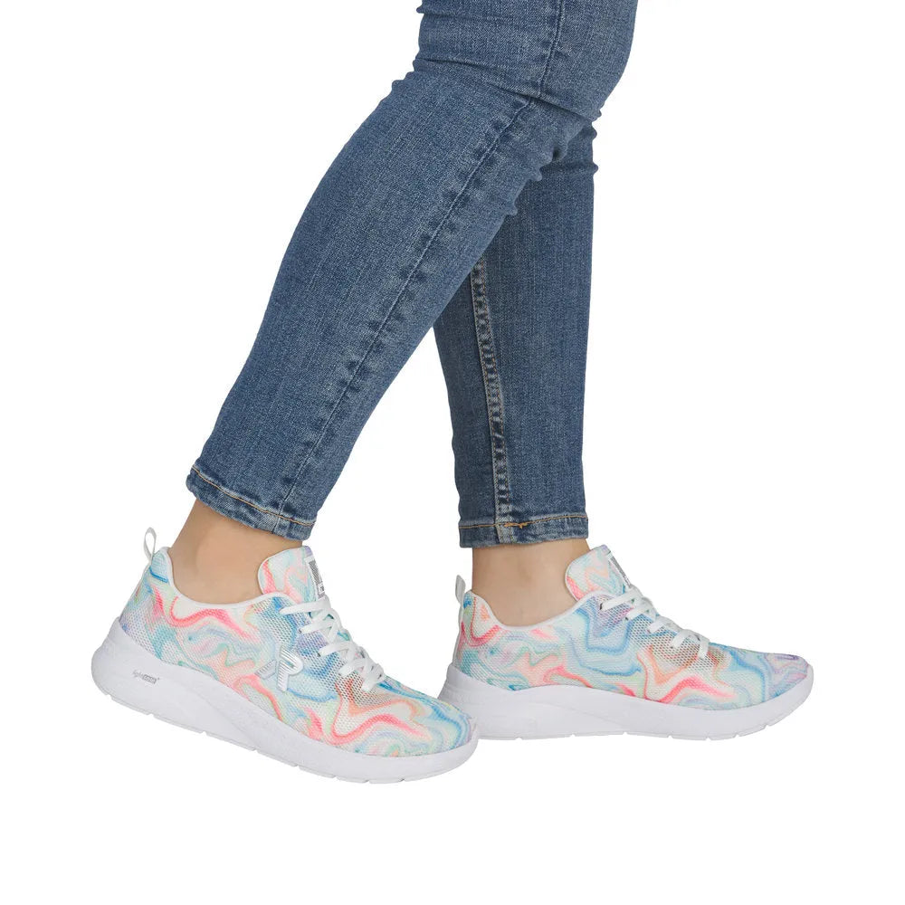 Rieker M8500-90 ladies multi-colored, vegan lace-up trainers with textile upper and white sole, styled with blue jeans.