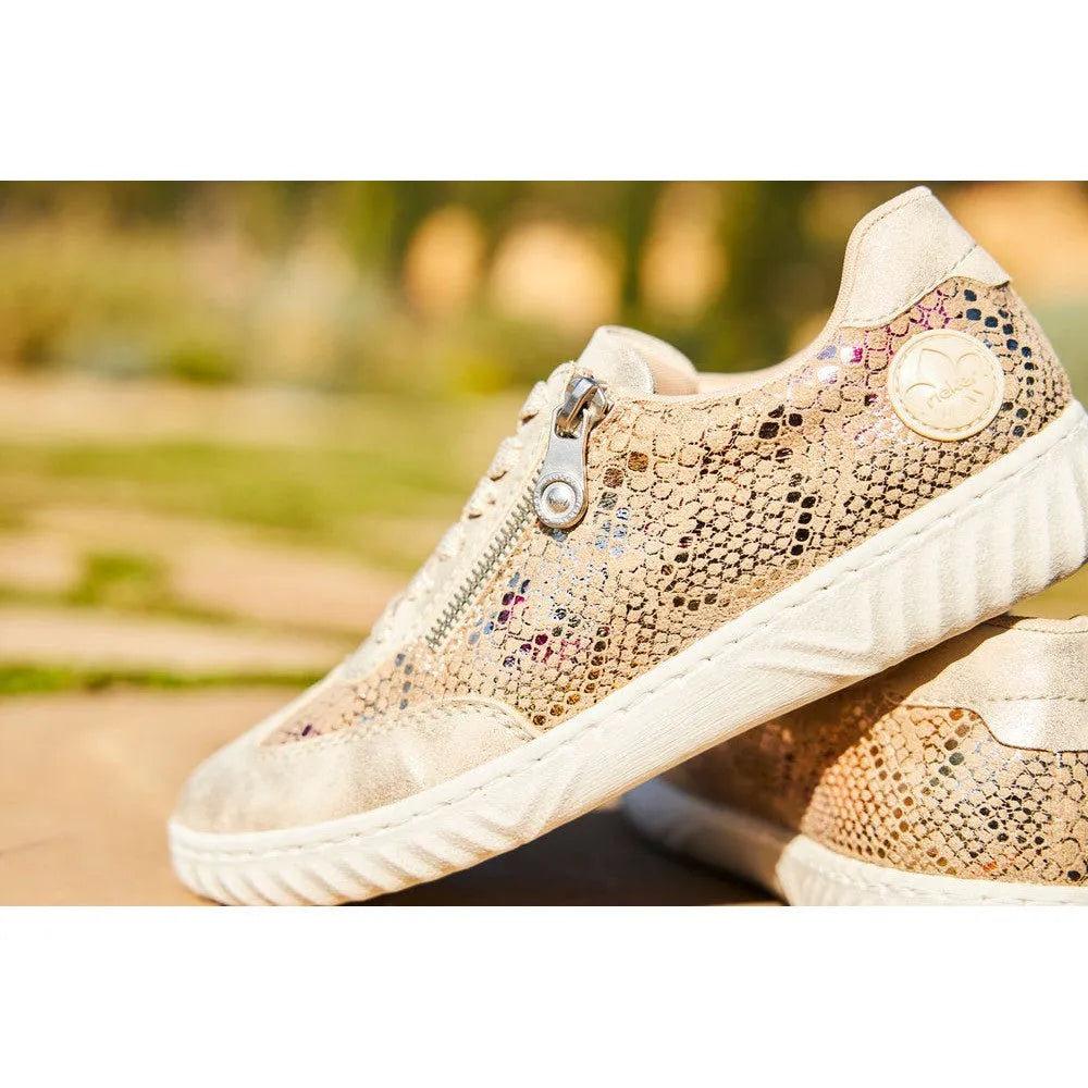 Rieker N0902-90 women's multi-zip and lace casual sneakers with snake print design and beige accents.