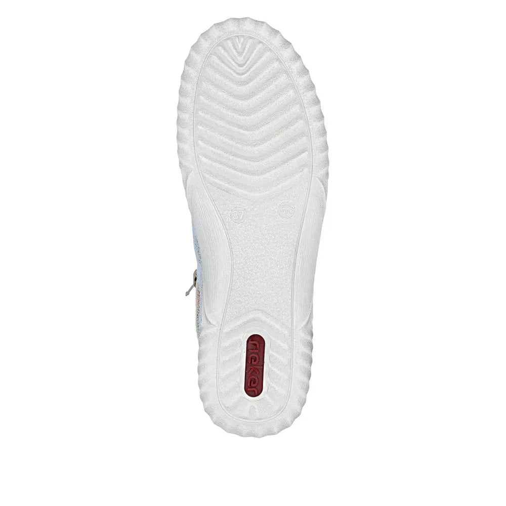 White suede lace-up shoes with textured sole and red logo detail on the bottom.
