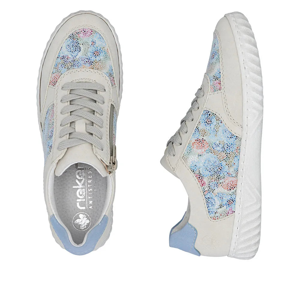 Rieker N0904-90 women's lace-up sneakers with multi-colored suede overlays, white soles, and light blue accents.