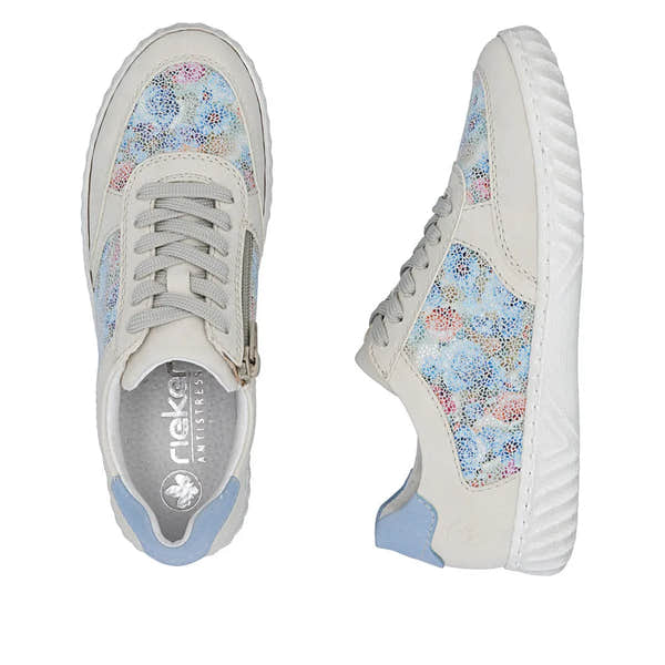 Rieker N0904-90 women's lace-up sneakers with multi-colored suede overlays, white soles, and light blue accents.