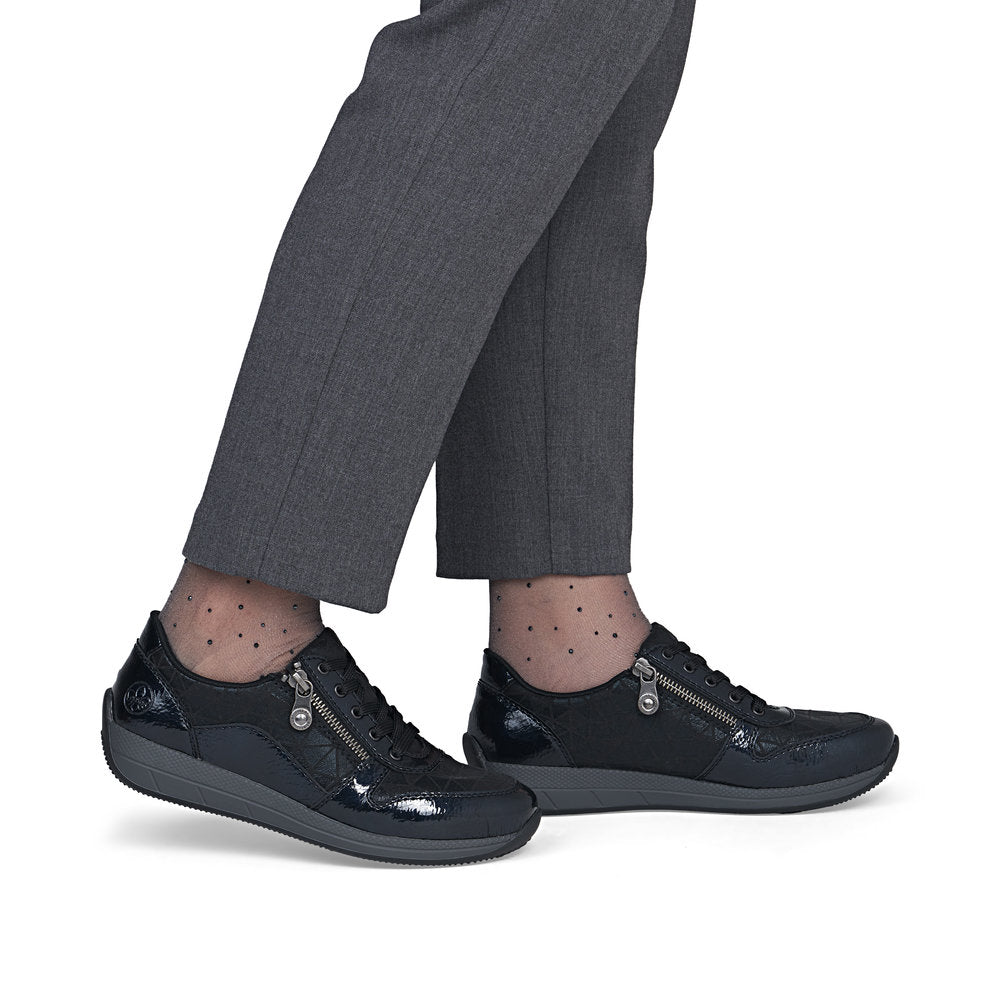 Rieker N1100-14 women's wide navy/black zip & lace shoes, on-foot lifestyle view.