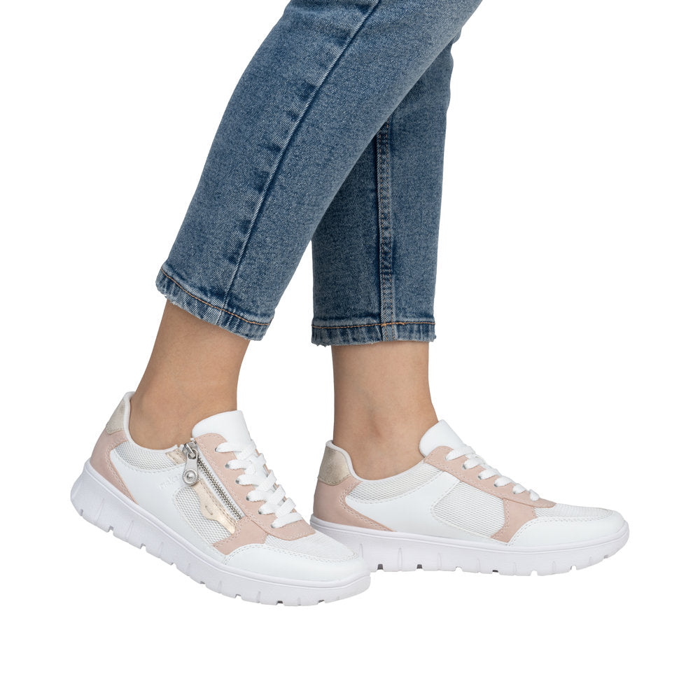 Rieker N1300-90 ladies wide-fit lace-up trainers with multi-zip design, beige and white color, and chunky sole.