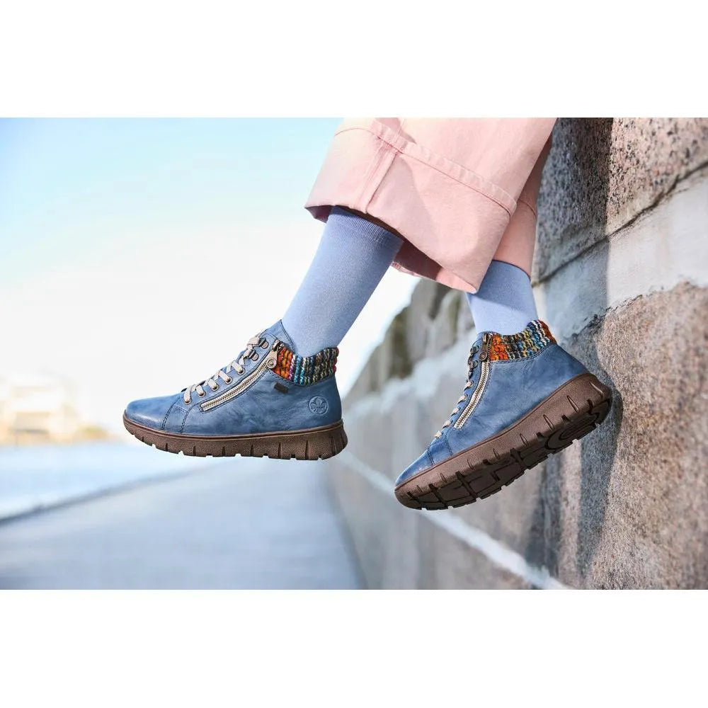 Rieker N1305-14 women's blue leather ankle boots with zip and lace, featuring colorful knit collar and chunky sole.